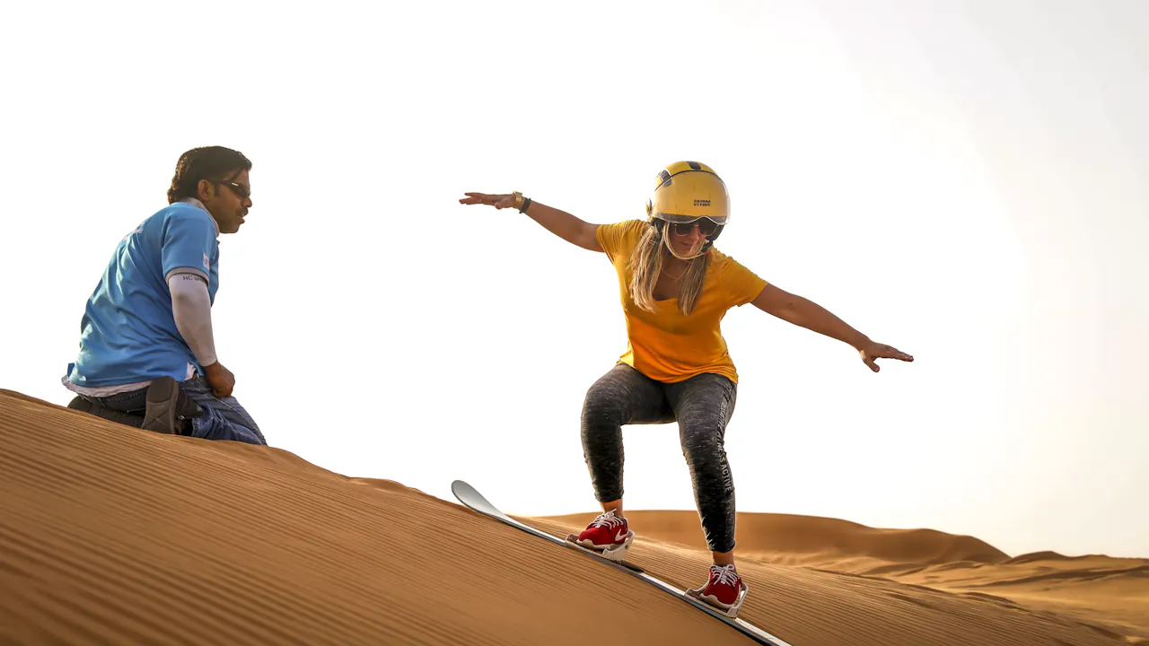Premium Morning Quad Bike Sandboarding and Camel Ride Location